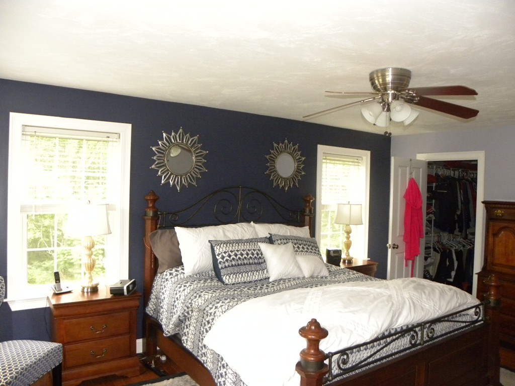 57 McIntyre Road Charlton, MA 01507 - Photo 10 of 30 a bedroom with a bed and a chandelier