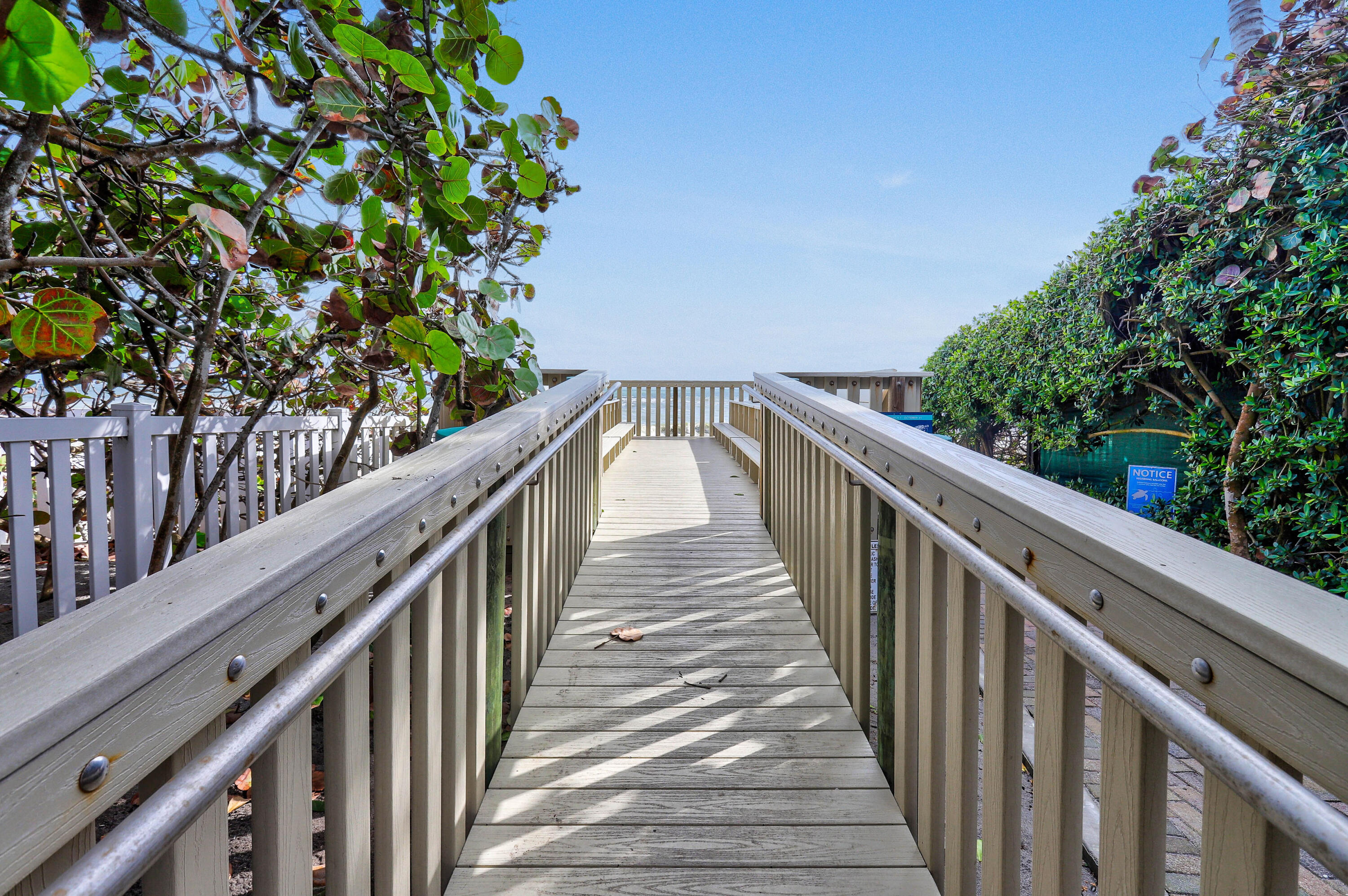 87 Lighthouse Drive Jupiter Inlet Colony, FL 33469 - Photo 24 of 31 a view of a balcony with wooden stairs