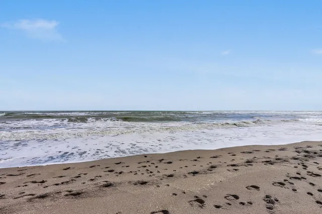 a view of a chairs in a backyard