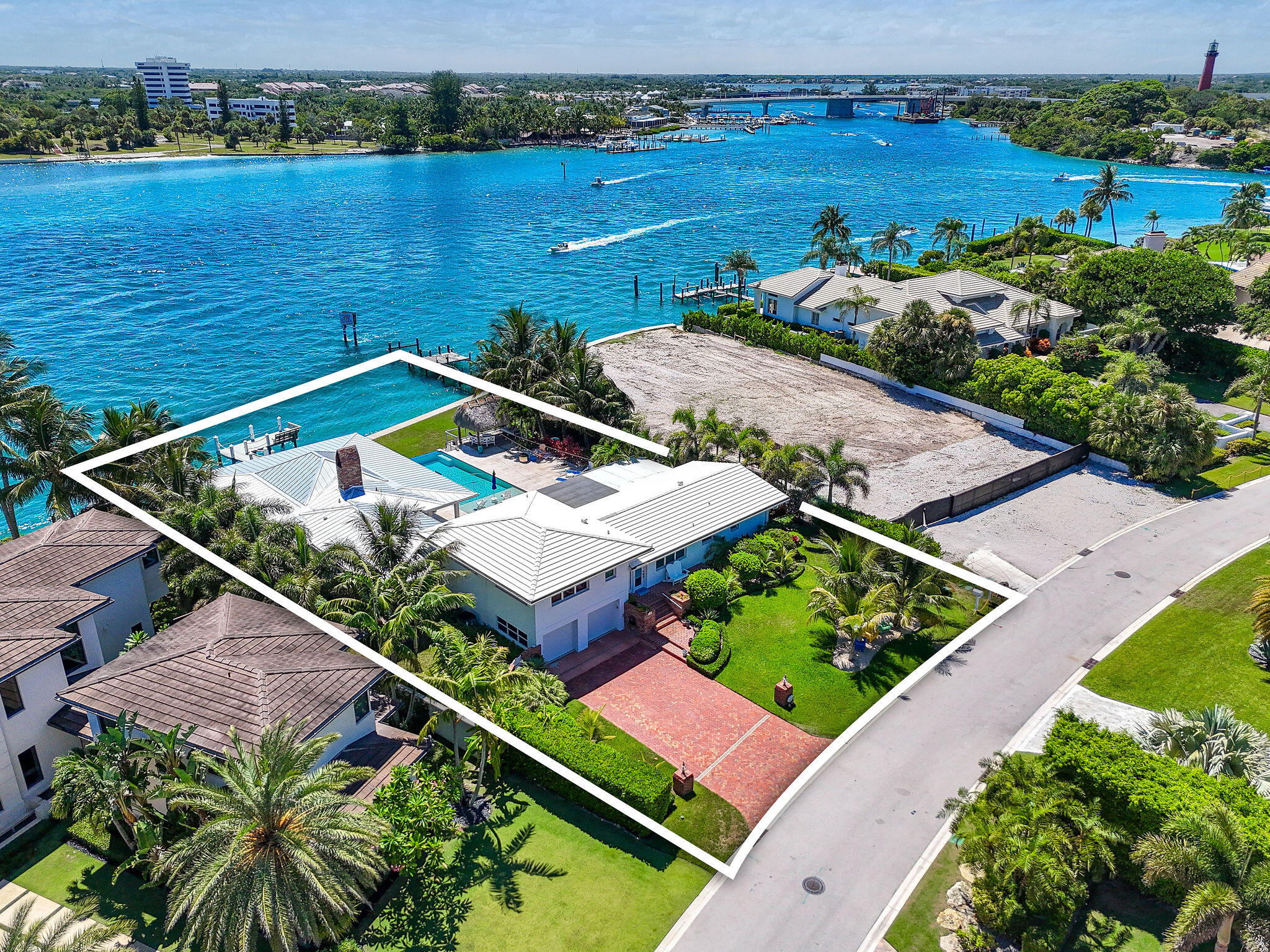 87 Lighthouse Drive Jupiter Inlet Colony, FL 33469 - Photo 3 of 31 an aerial view of a house with a garden