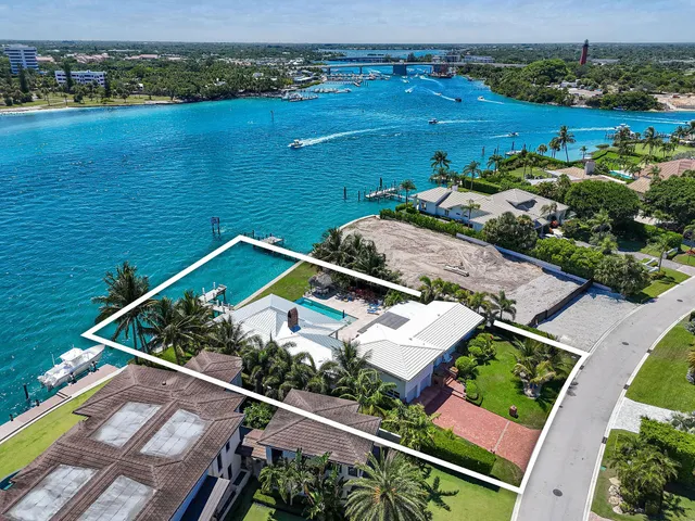 an aerial view of a house with a lake view