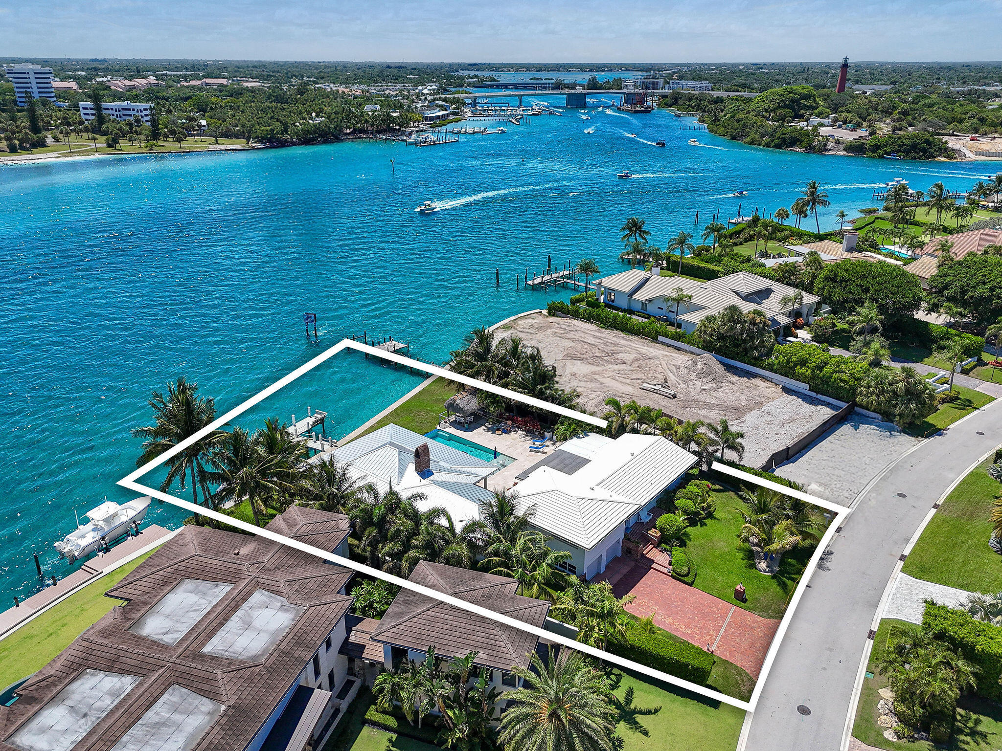 87 Lighthouse Drive Jupiter Inlet Colony, FL 33469 - Photo 6 of 31 an aerial view of a house with a lake view