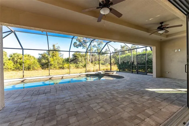 a kitchen with granite countertop kitchen island stainless steel appliances a stove sink and microwave