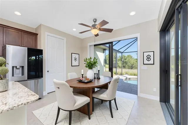 a kitchen with granite countertop wooden cabinets and entryway