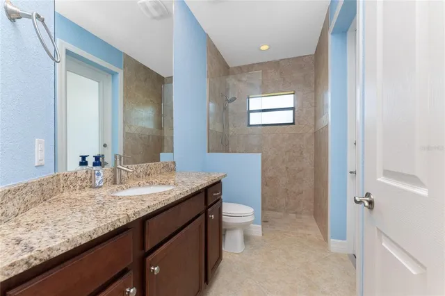a view of a storage & utility room with a sink