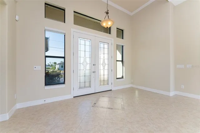 a view of a livingroom with a ceiling fan and window
