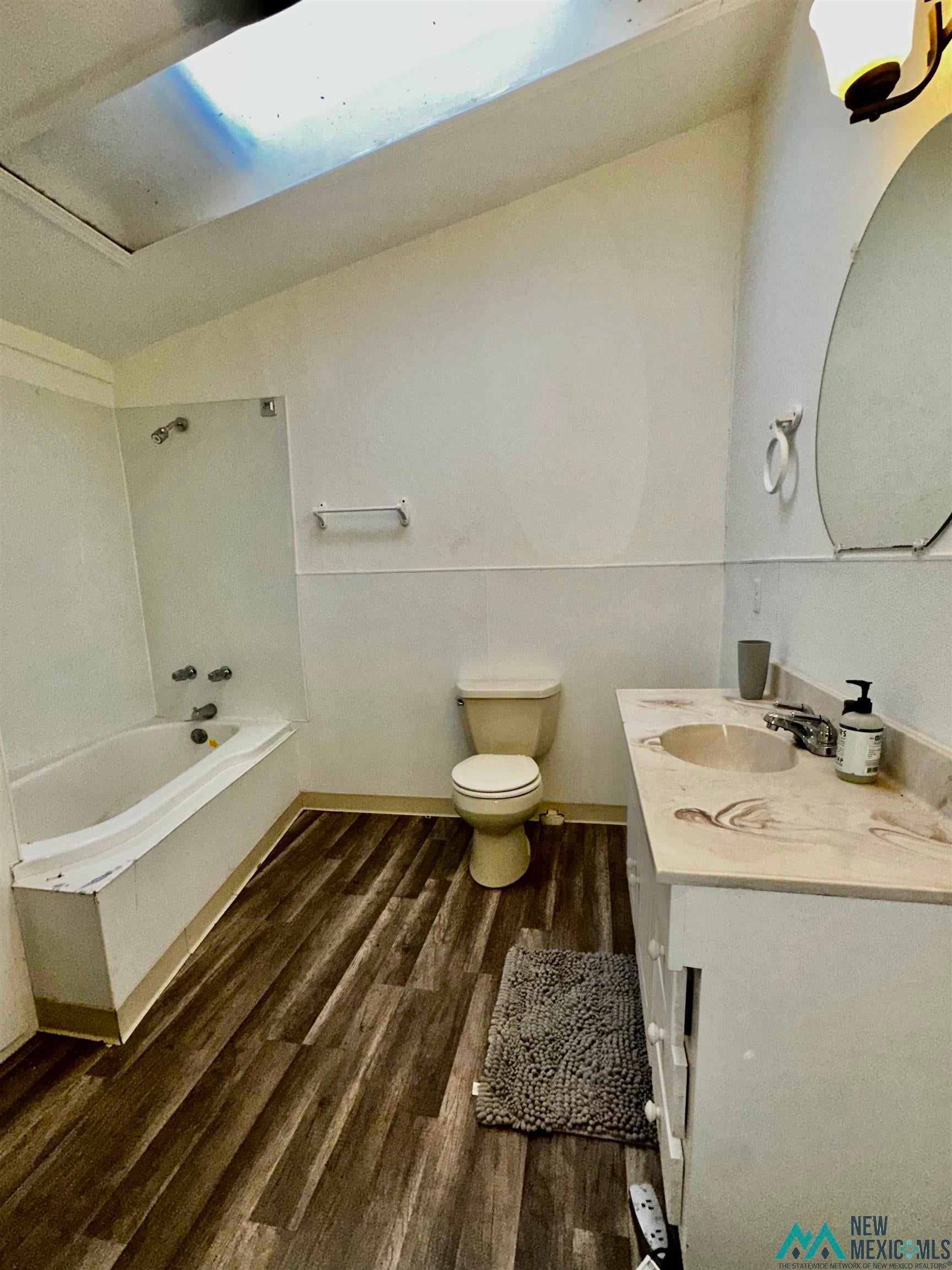 31 Bill Knight Gap Road Luna, NM 87824 - Photo 30 of 41 Bathroom featuring vanity, shower / washtub combination, and dark wood-type flooring