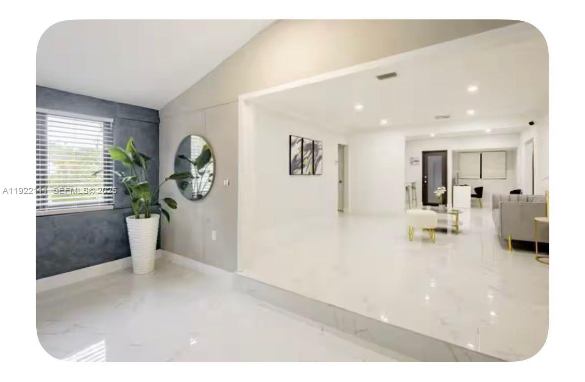 1301 Northwest 99th Street, Unit A Miami, FL 33147 - Photo 2 of 10 a view interior of a house and natural light
