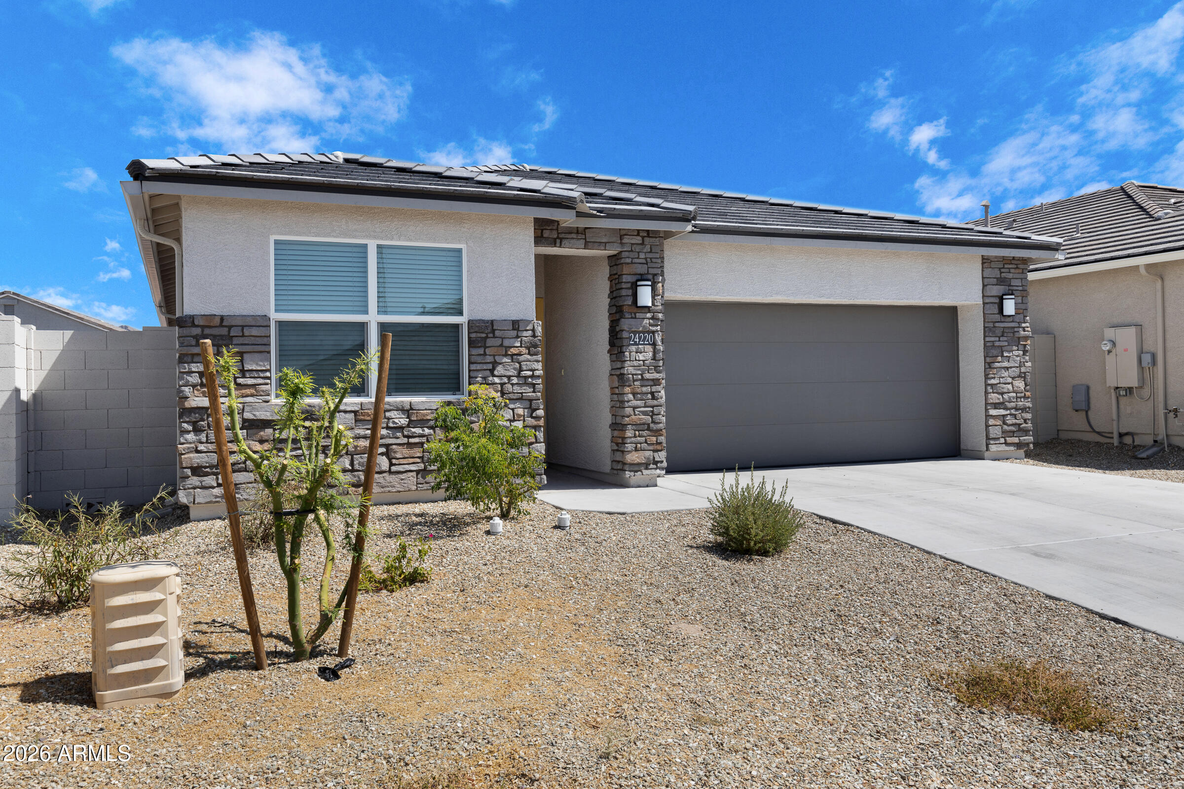 24220 West Ripple Road Buckeye, AZ 85326 - Photo 1 of 10 a front view of a house