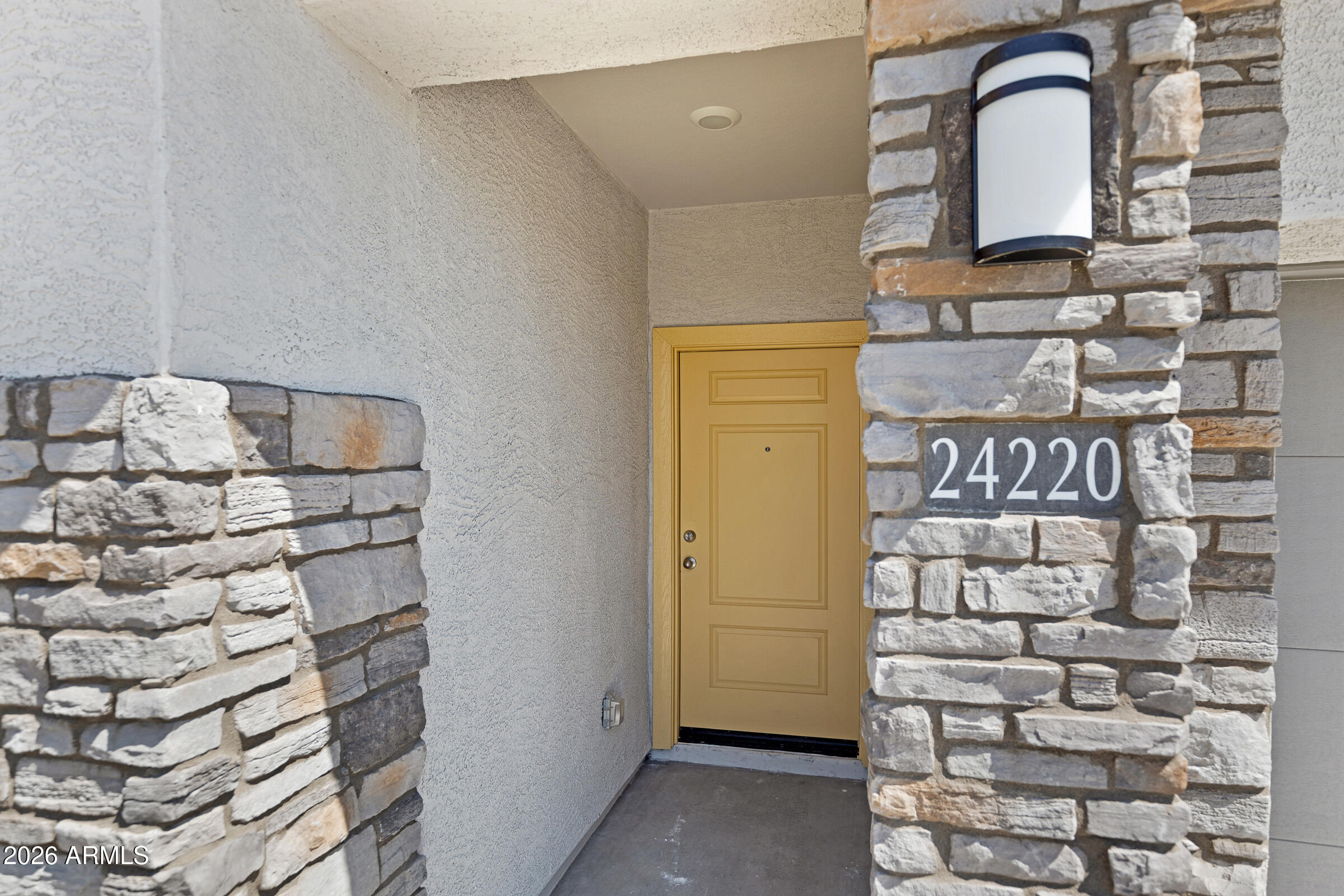 24220 West Ripple Road Buckeye, AZ 85326 - Photo 4 of 10 a bathroom with a sink and a mirror
