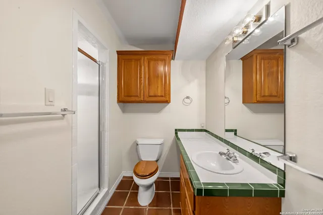a kitchen with stainless steel appliances a sink stove and cabinets