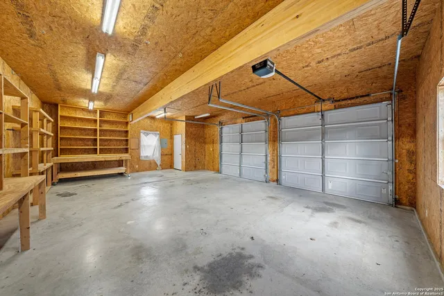 an aerial view of a house with a garden