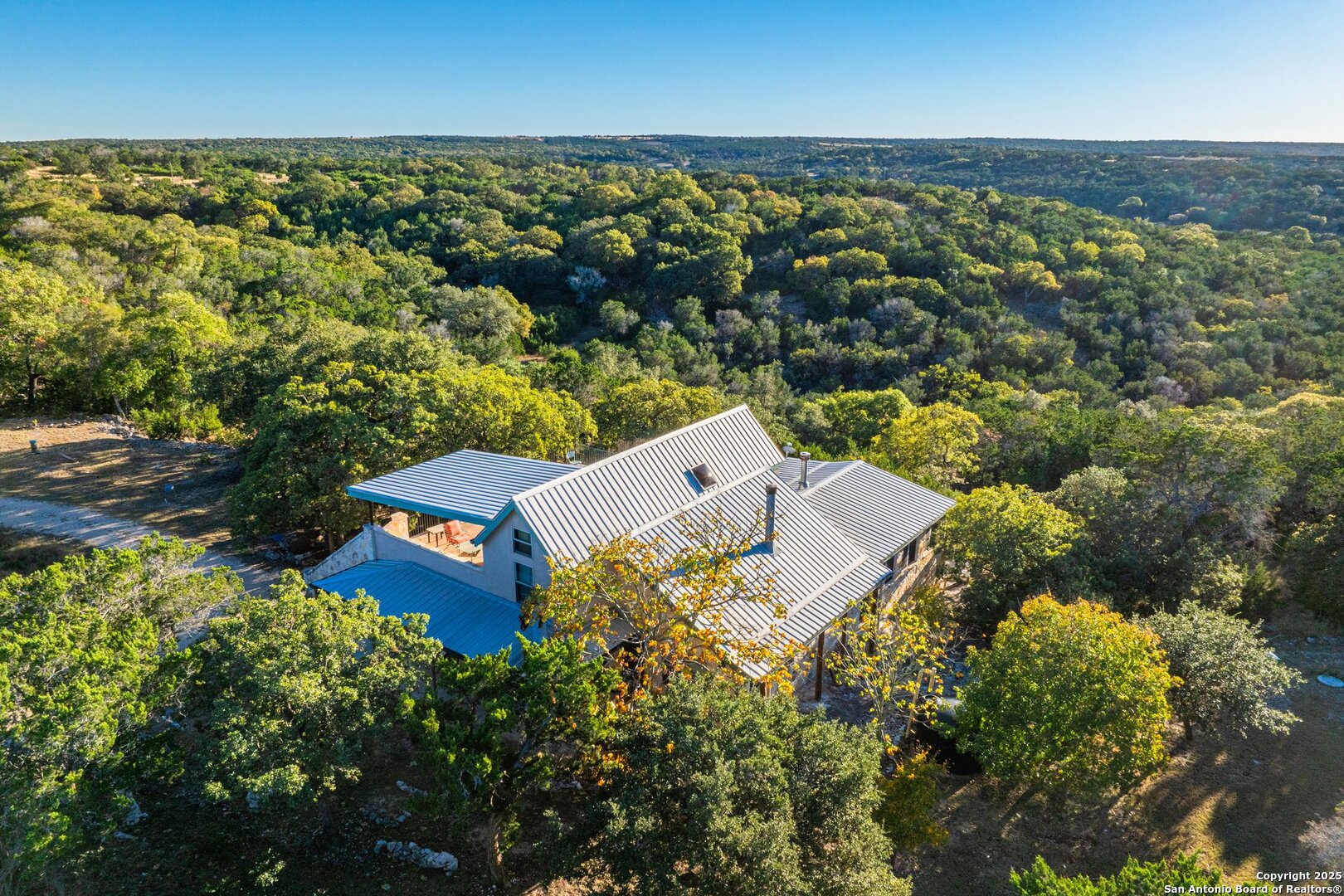 125 Turkey Trot Trail Southwest Hunt, TX 78024 - Photo 33 of 40 an aerial view of a house with a garden