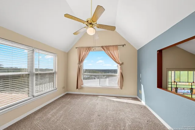 a view of an entryway with a floor to ceiling windows and a livingroom
