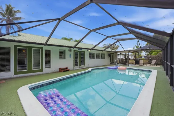 a view of a backyard with a patio