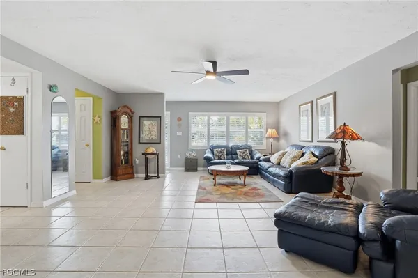 a living room with furniture and a window