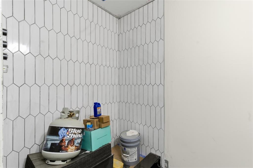 1361 Hawthorne Street Pittsburgh, PA 15201 - Photo 15 of 50 a bathroom with a sink toilet and shower curtain