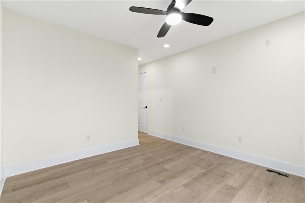1361 Hawthorne Street Pittsburgh, PA 15201 - Photo 25 of 50 an empty room with wooden floor and windows