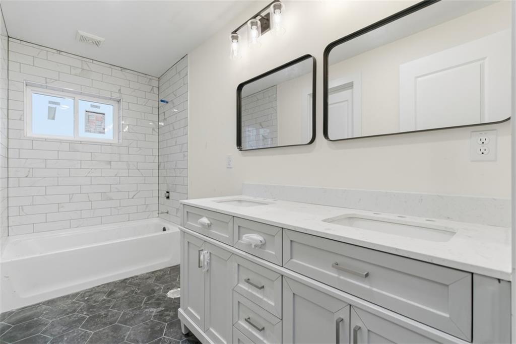 1361 Hawthorne Street Pittsburgh, PA 15201 - Photo 27 of 50 a bathroom with a sink and a bathtub
