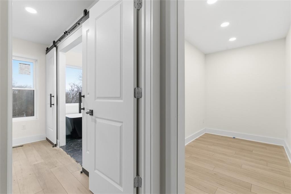 1361 Hawthorne Street Pittsburgh, PA 15201 - Photo 28 of 50 a view of a big room with wooden floor and windows