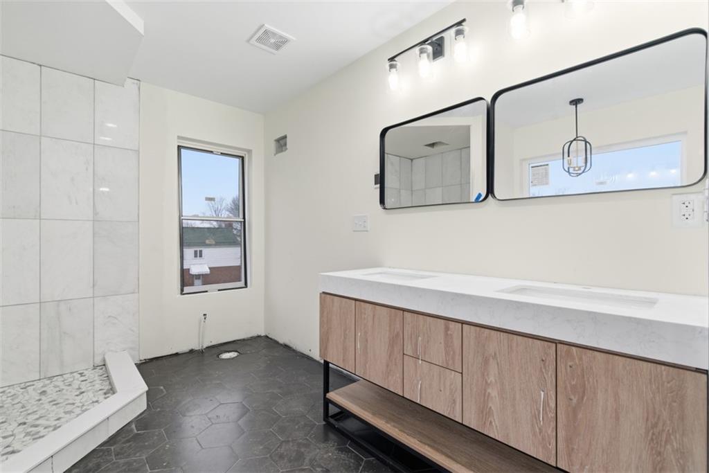 1361 Hawthorne Street Pittsburgh, PA 15201 - Photo 32 of 50 a bathroom with a sink and a mirror