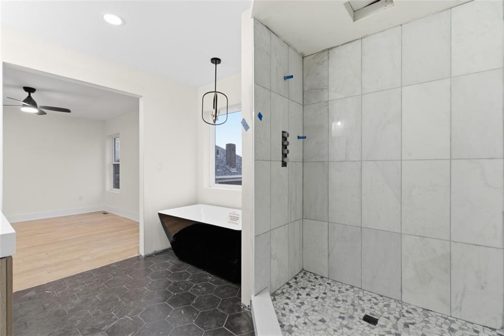 1361 Hawthorne Street Pittsburgh, PA 15201 - Photo 33 of 50 a bathroom with a glass door shower