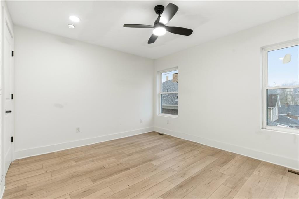 1361 Hawthorne Street Pittsburgh, PA 15201 - Photo 36 of 50 an empty room with windows and fan