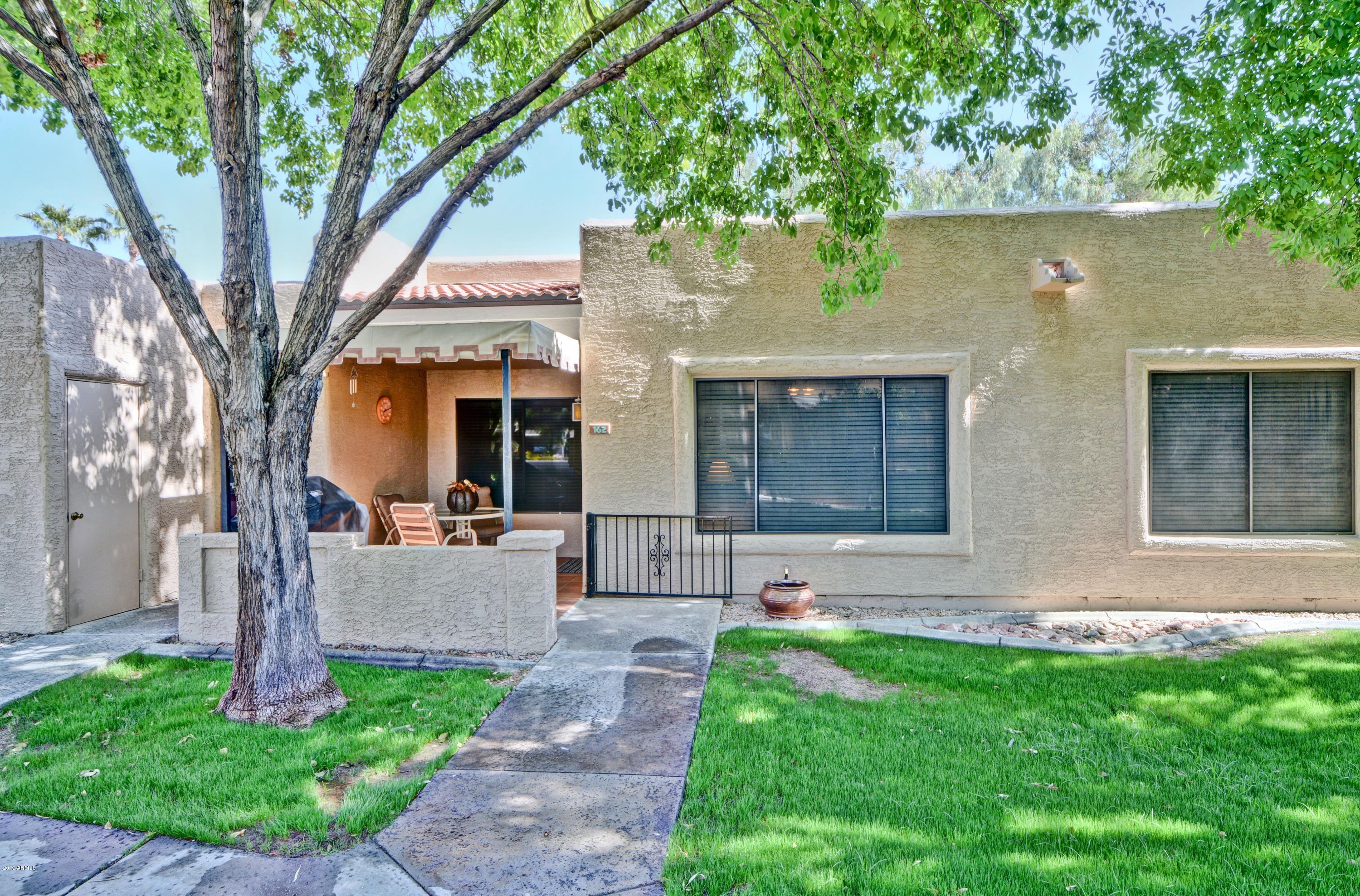 14300 West Bell Road, Unit 162 Surprise, AZ 85374 - Photo 1 of 23 a front view of a house with garden