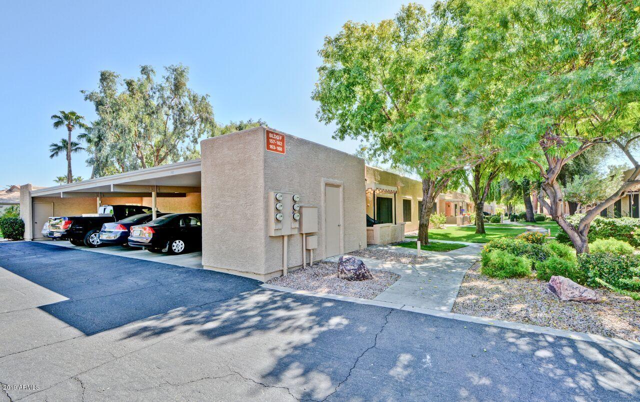 14300 West Bell Road, Unit 162 Surprise, AZ 85374 - Photo 14 of 23 a view of a car park in front of a house