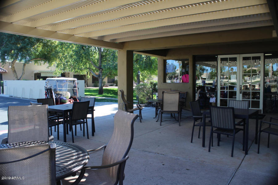 14300 West Bell Road, Unit 162 Surprise, AZ 85374 - Photo 23 of 23 a view of a dining room with furniture window and outside view