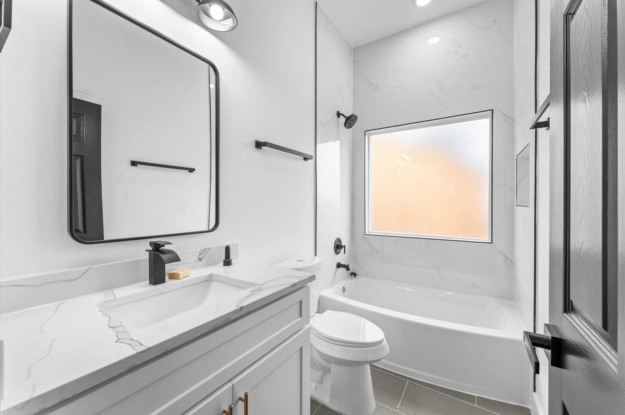 1133 Longleaf Pne Street Huffman, TX 77336 - Photo 24 of 25 Beautifully designed guest bath with modern tile and updated fixtures.