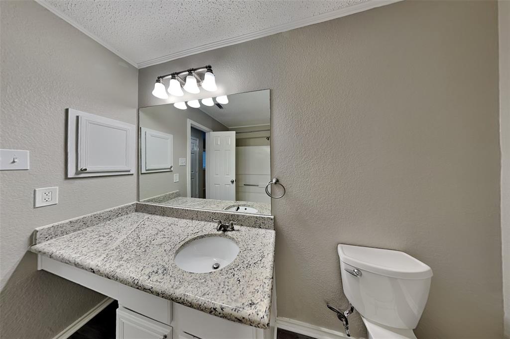 308 Cortland Circle Roanoke, TX 76262 - Photo 15 of 21 a bathroom with a granite countertop sink and a mirror