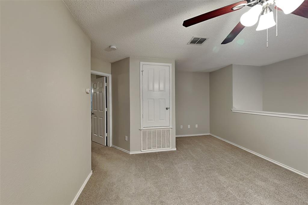 308 Cortland Circle Roanoke, TX 76262 - Photo 18 of 21 an empty room with chandelier fan