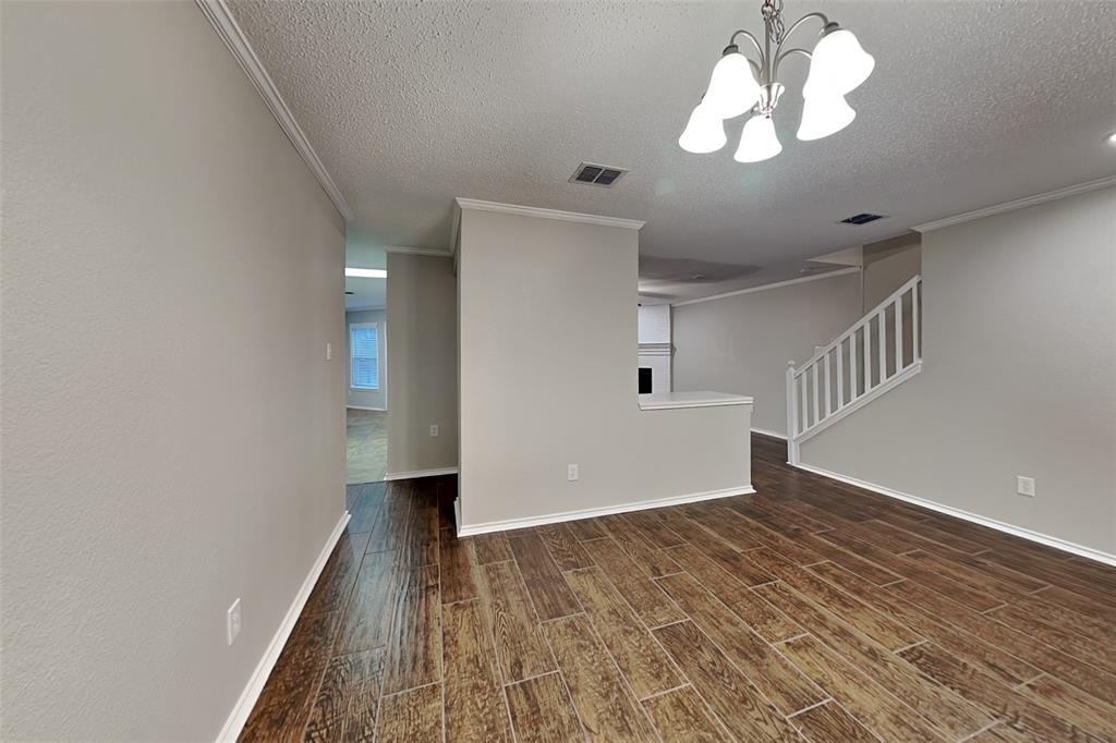 308 Cortland Circle Roanoke, TX 76262 - Photo 3 of 21 wooden floor in an empty room with a window