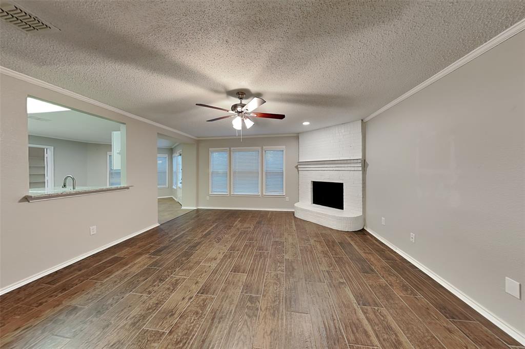 308 Cortland Circle Roanoke, TX 76262 - Photo 4 of 21 a view of empty room with wooden floor and fan