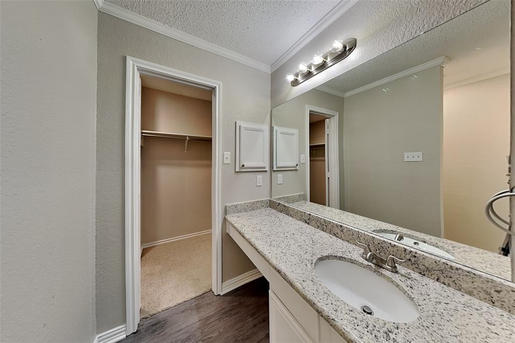 308 Cortland Circle Roanoke, TX 76262 - Photo 9 of 21 a bathroom with a granite countertop double vanity and a mirror