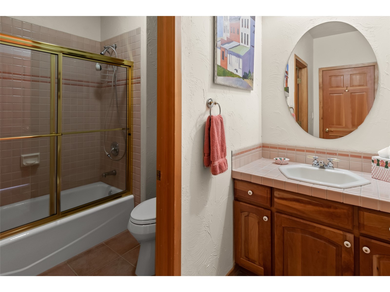 1746 South Ruby Road Silverthorne, CO 80498 - Photo 41 of 50 Full bathroom featuring shower / bath combination with glass door, vanity, toilet, and tile floors