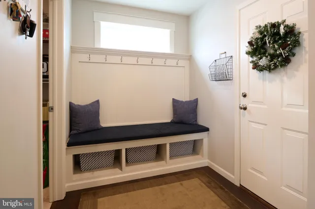 a bathroom with a toilet and a mirror