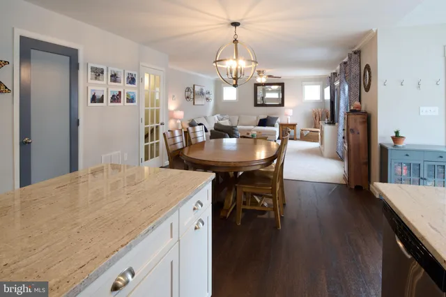 a spacious bathroom with a double vanity sink a mirror and a bathtub