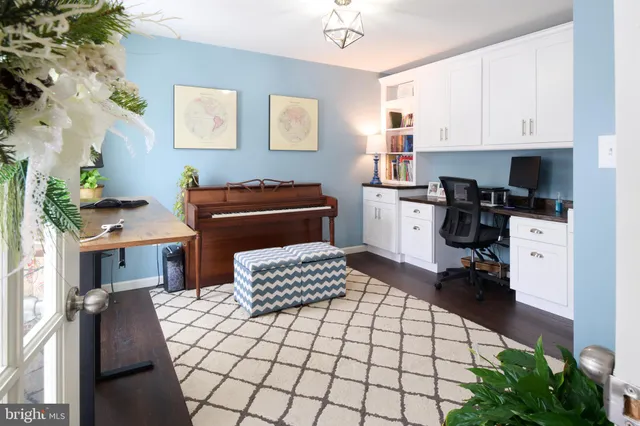 a room with a dresser and a mirror