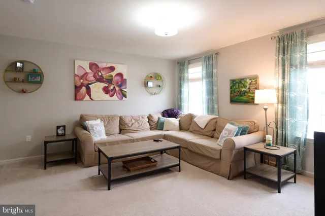 a view of walk in closet with clothes