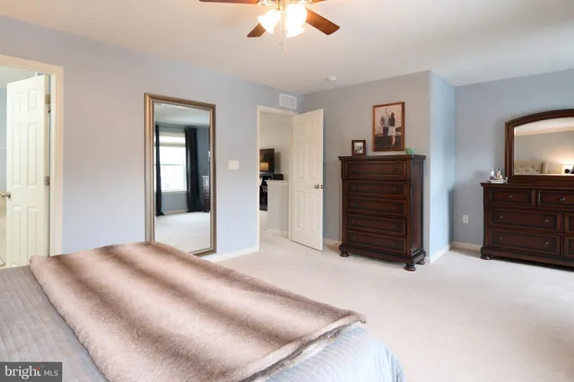 a bathroom with a sink toilet and mirror