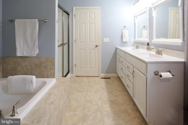 a view of a patio with table and chairs with wooden floor