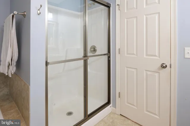 a view of a patio with table and chairs a barbeque with wooden floor