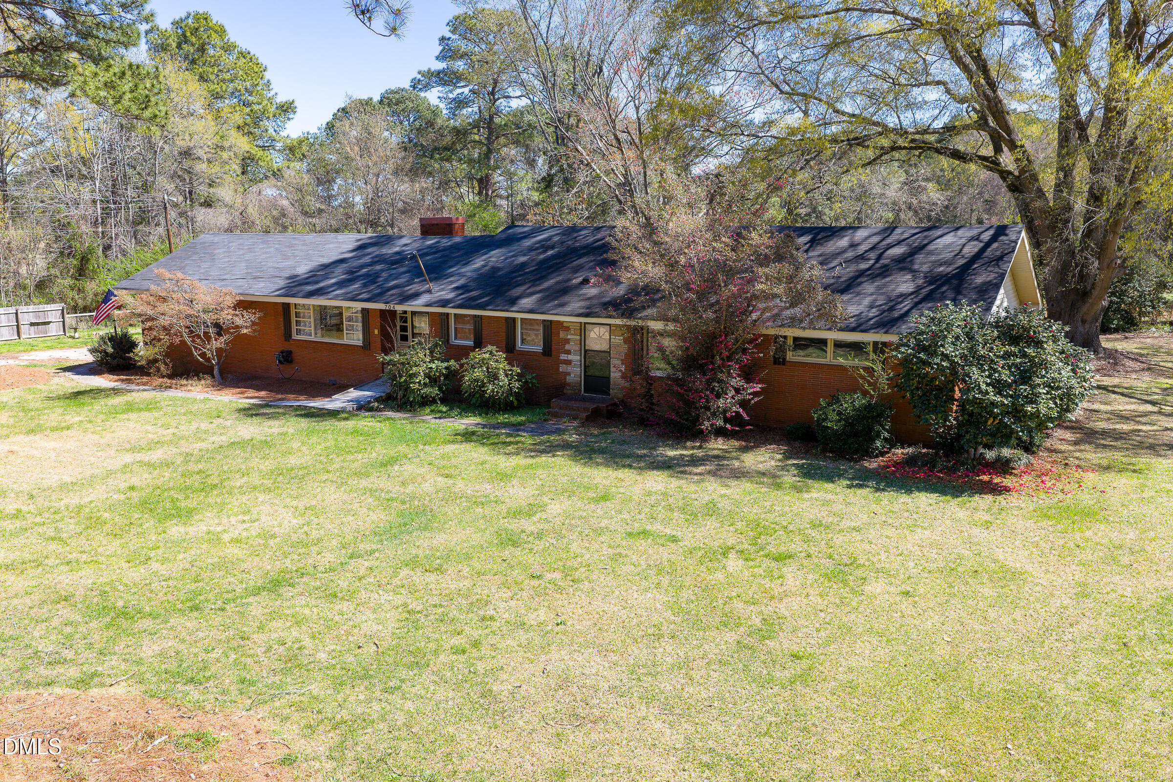 704 Pearces Road Zebulon, NC 27597 - Photo 1 of 26 a view of a house with a yard