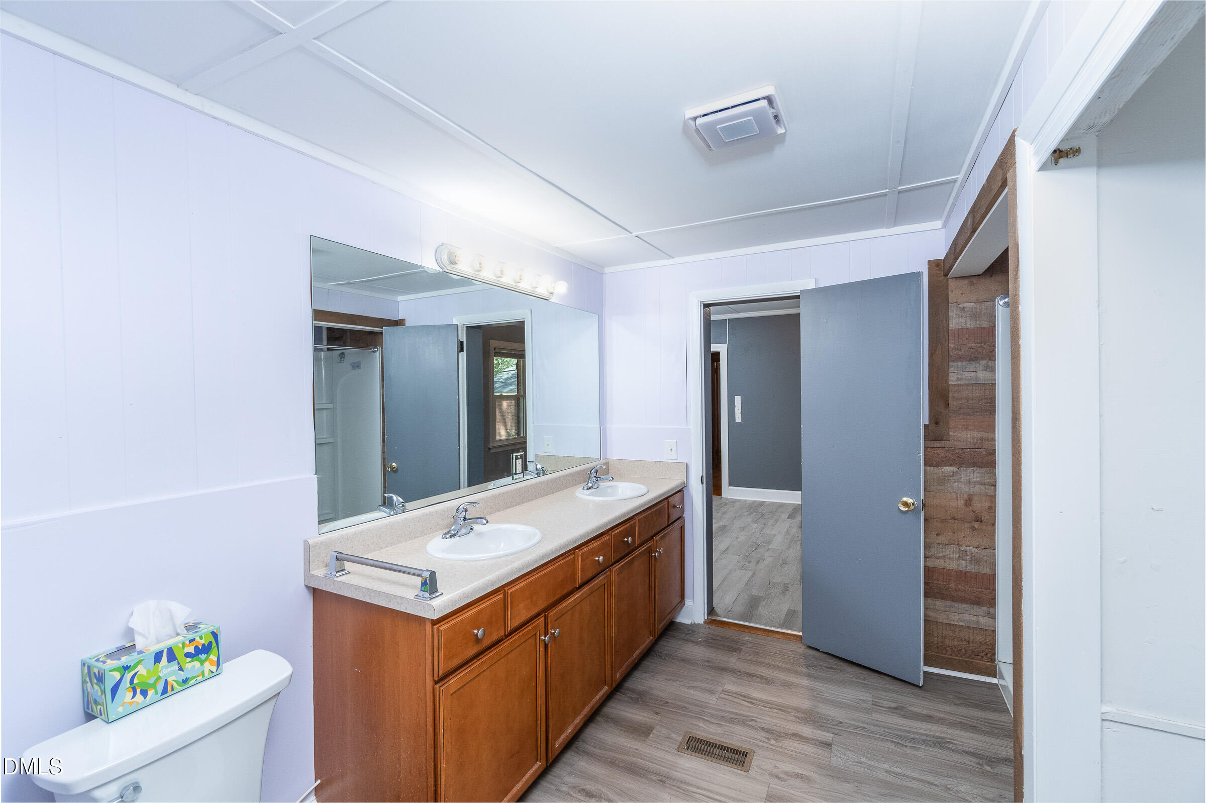 704 Pearces Road Zebulon, NC 27597 - Photo 12 of 26 a bathroom with a sink and a mirror