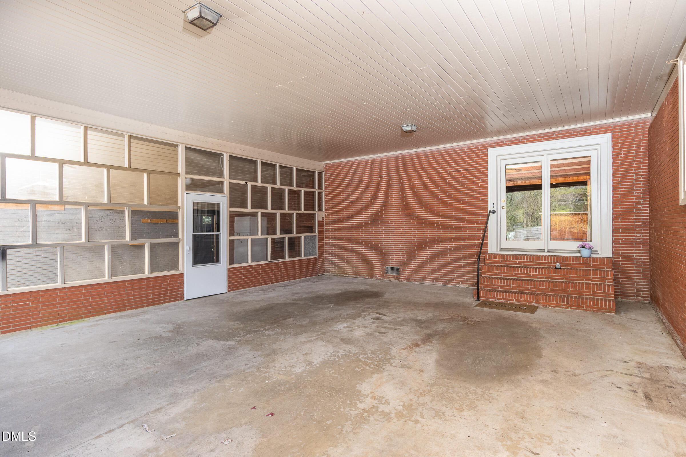 704 Pearces Road Zebulon, NC 27597 - Photo 18 of 26 an empty room with windows