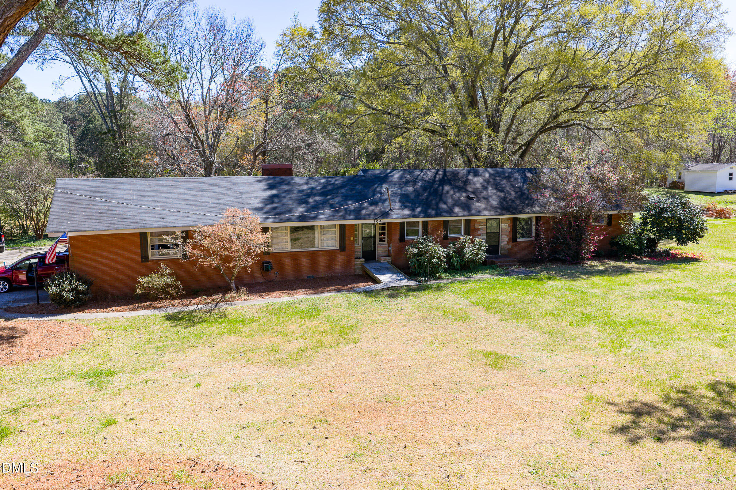704 Pearces Road Zebulon, NC 27597 - Photo 22 of 26 a view of backyard with swimming pool