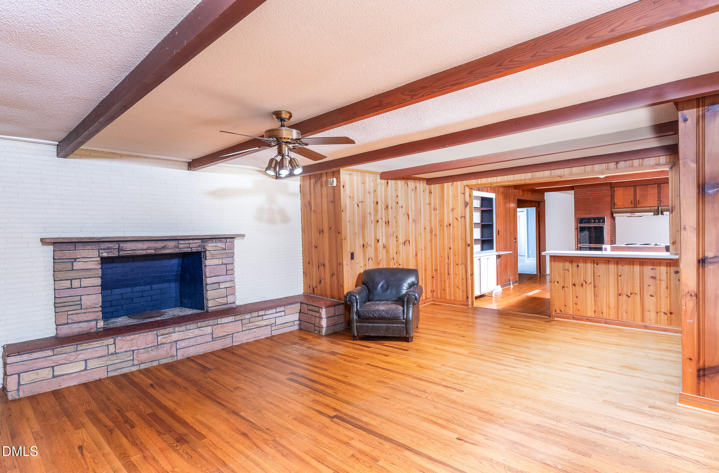 704 Pearces Road Zebulon, NC 27597 - Photo 3 of 26 a living room with furniture and a fireplace