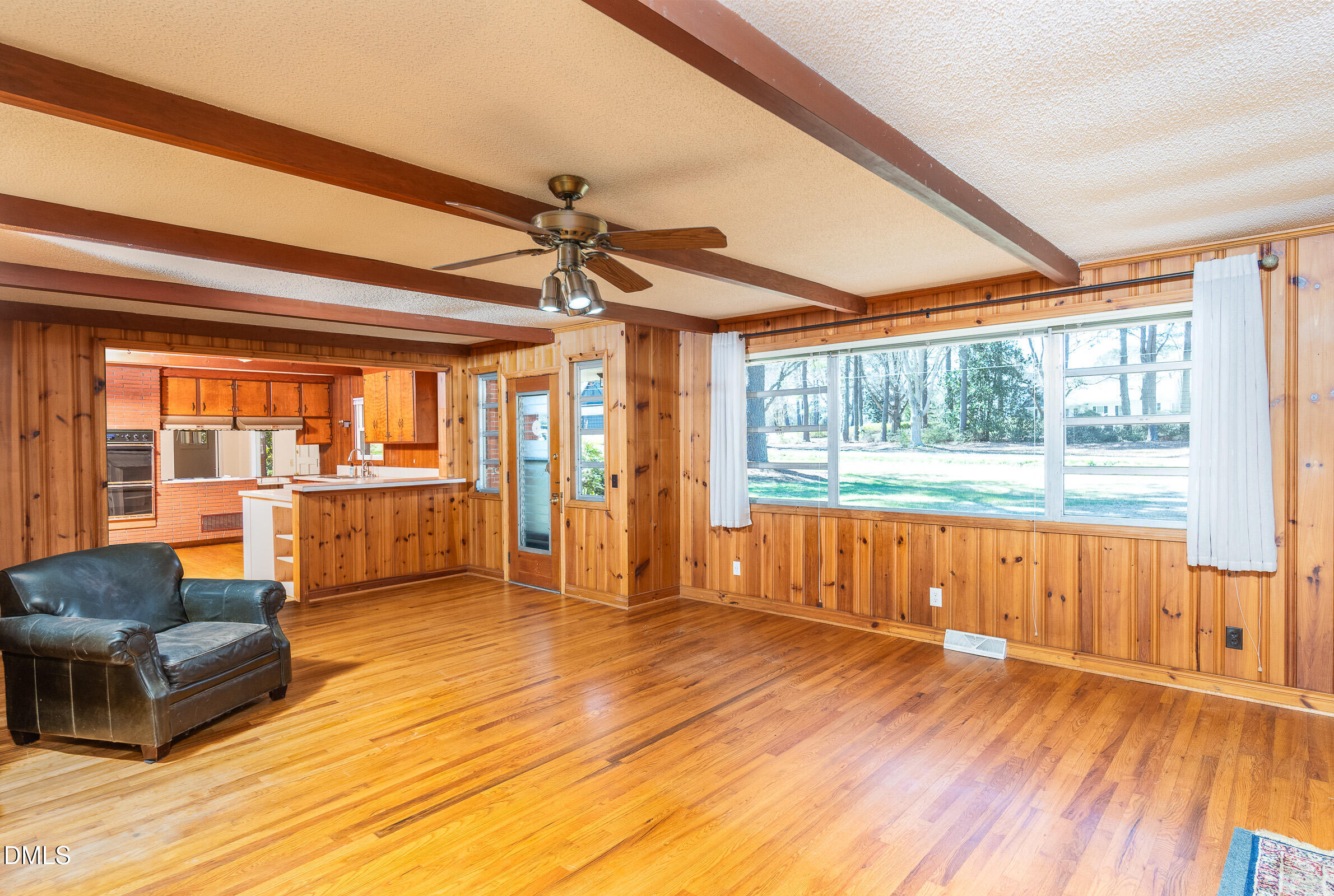 704 Pearces Road Zebulon, NC 27597 - Photo 5 of 26 a living room with furniture and a large window